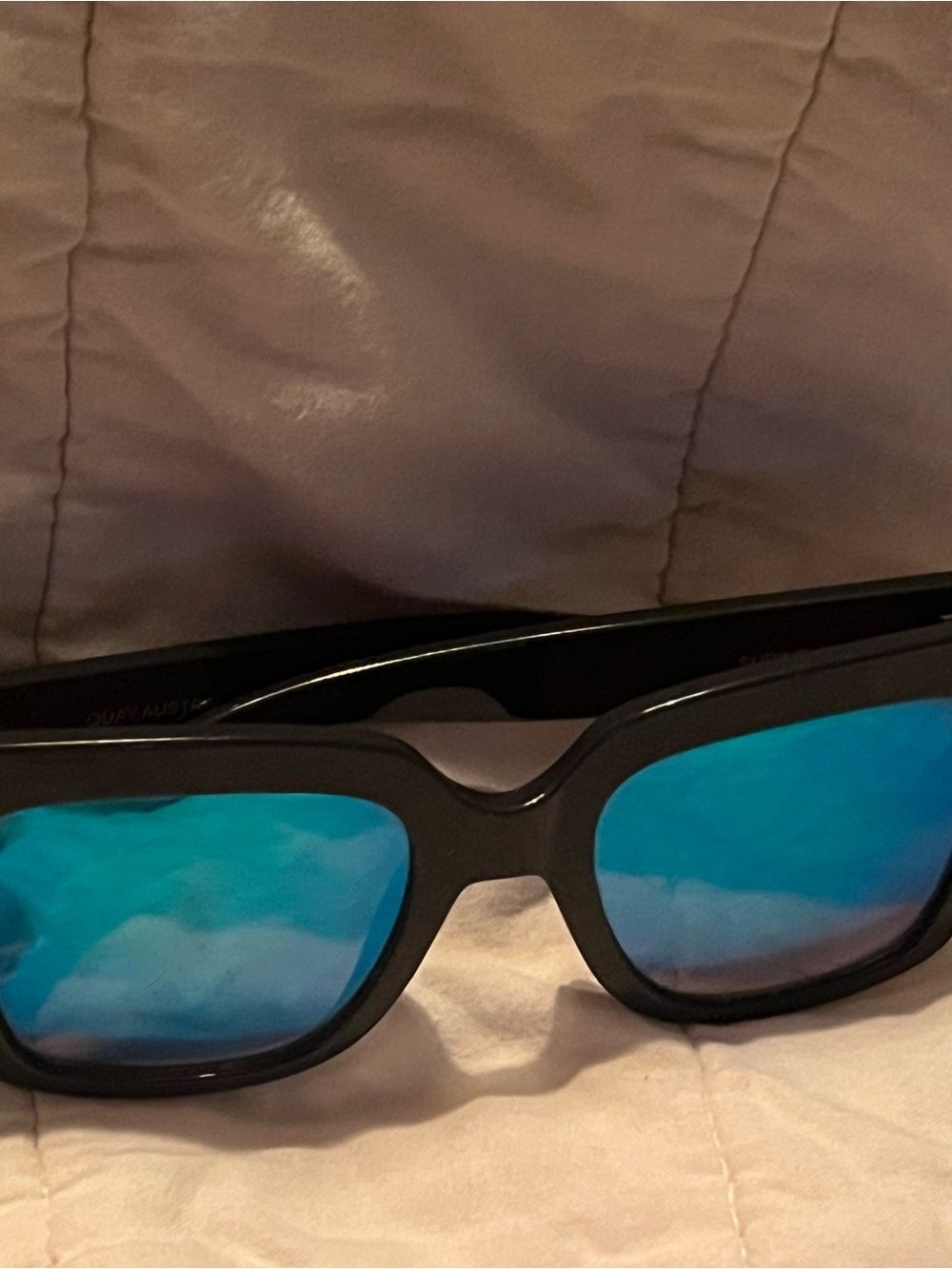 Quay Australia Supine polarized blue mirrored glasses.